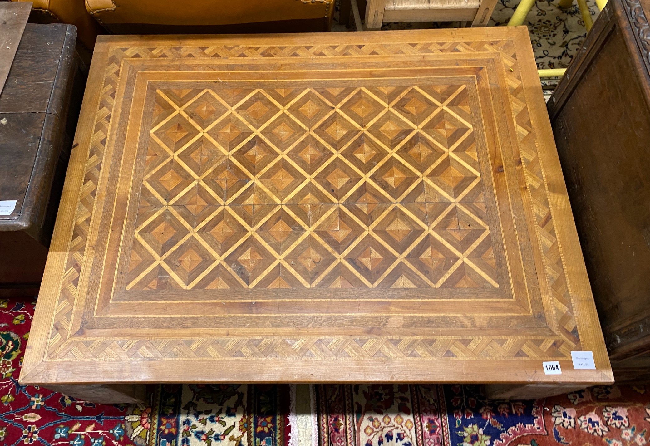 A rectangular parquetry coffee table, width 115cm, depth 89cm, height 40cm